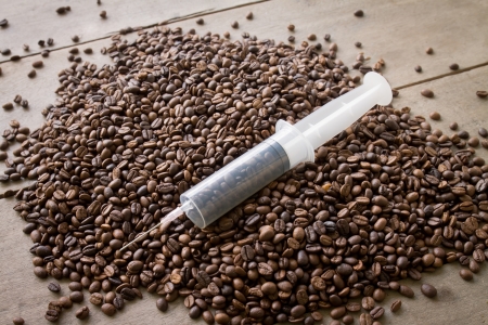 coffee seed in syringe, mean to caffeine addictionの写真素材