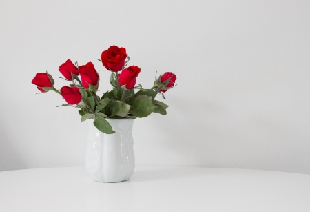 still life of red rose in ceramic vaseの写真素材