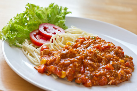 plate with spaghetti, sauce and tomato, italian foodの写真素材