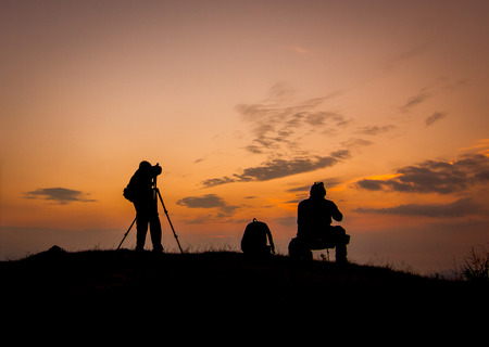 Silhouette of photographers with beautiful skyの写真素材