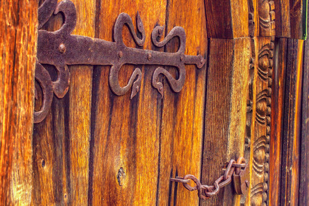 a antique wooden doors on forged curtains lockeの写真素材