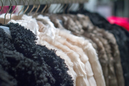 Image winter coat hanging on the rack in the storeの写真素材