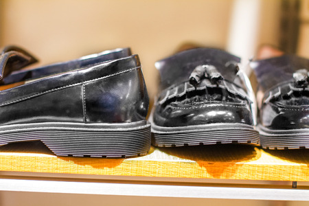 image black man's shoes stand on a shelf in the storeの写真素材