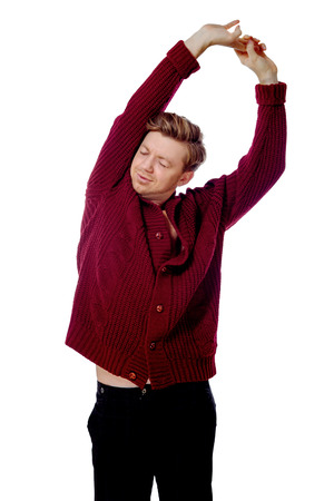 image of a young man dressed in a maroon sweaterの写真素材