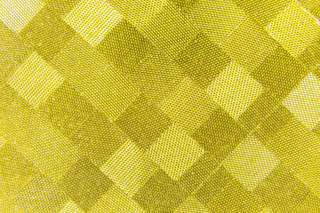 image of yellow golden checkered shiny paper backgroundの写真素材