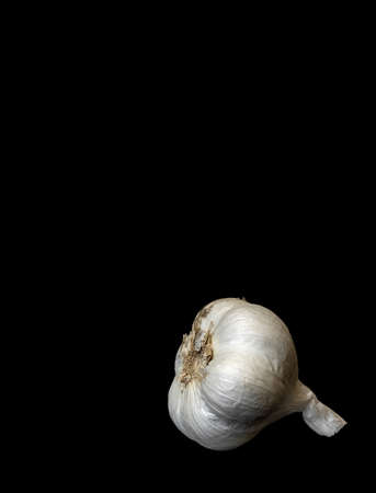 Image of white garlic on black background
