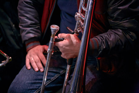 Image of musician trombonist holding his tromboneの写真素材