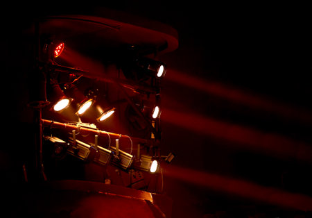 Image of theater box with red light spotlights