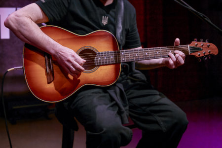 Image of Ukrainian male bard playing guitarの写真素材