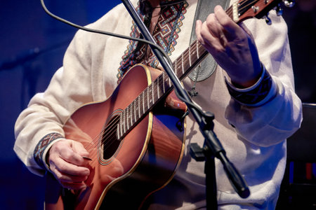 Image of a guitarist playing an acoustic guitarの写真素材