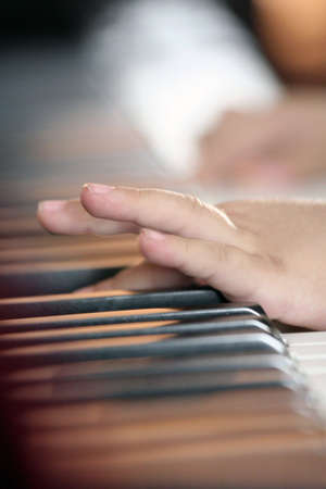 The baby hands play the piano.の写真素材