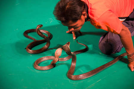 Between man and snake performancesのeditorial素材