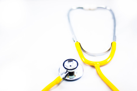 Yellow Stethoscope in isolated whiteの写真素材