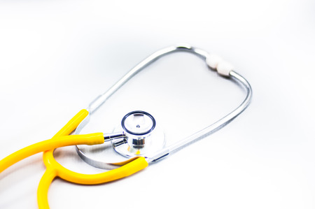 Yellow Stethoscope in isolated whiteの写真素材