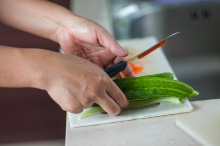 Vegetables cutting with women handの写真素材