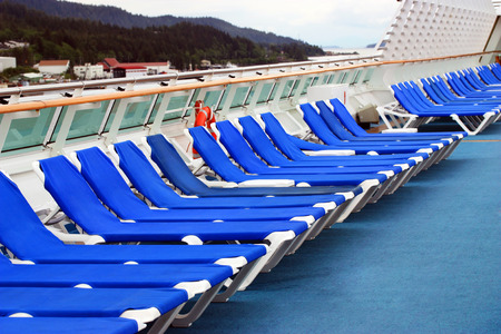Row of beach chairs on cruise ship deckの写真素材
