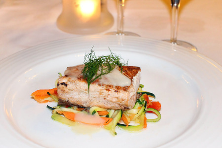 Freshly grilled salmon at the restaurantの写真素材