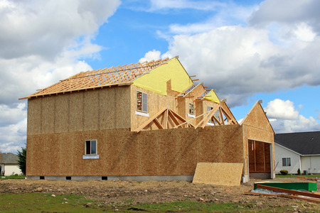 Building a family home in suburban neighborhoodの写真素材