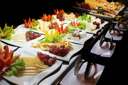 Variety of cheese on platesの写真素材