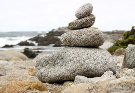 Stack of rocks by the oceanの写真素材
