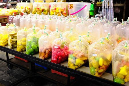 Fruit wrapped in plastic for sale, Penang, Malaysia.の写真素材