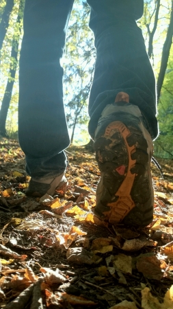 closeup of man walking in the woods. の素材
