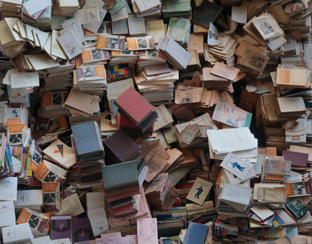Barcelona, Spain - November 10, 2016 - Detail on piled books in the Fira dels encants flea market, biggest bargains and flea stands in the Spanish cityのeditorial素材