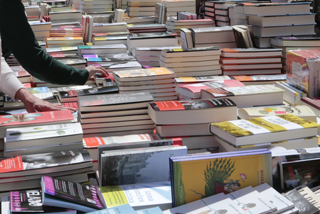 Palma de Mallorca, Spain - April 23, 2016 - Customers on a public street flea market during books day festivity in Palma de mallorcaのeditorial素材