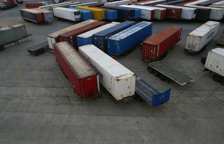Cargo containers waiting to be loaded in a cargo vessel in Palma de Mallorca seaport.The term...