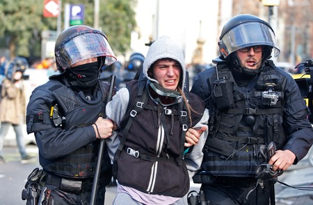 Barcelona, Spain - December 21, 2018 - Anti clash riots police charge against demonstrators during...