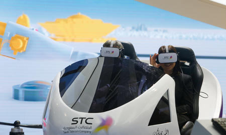 Barcelona, Spain - February 26, 2019 - Visitors checks VR experience on a taxi drone project inside...