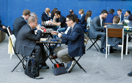 Barcelona, Spain - February 26, 2019 - Businessmen during lunch time during Mobile World Congress in Barcelonaのeditorial素材