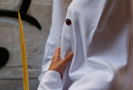 Palma de Mallorca, Spain - April 14 2019 - Penitents take part in the procession of Saint christ of Santa Cruz during easter holy week in the Spanish islandのeditorial素材