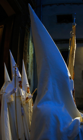 Palma de Mallorca, Spain - April 17 2019 - Penitents take part in the procession of Saint christ of Santa Cruz during easter holy week in the Spanish islandのeditorial素材
