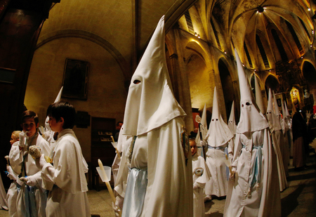 Palma de Mallorca, Spain - April 17 2019 - Penitents take part in the procession of Saint christ of Santa Cruz during easter holy week in the Spanish islandのeditorial素材