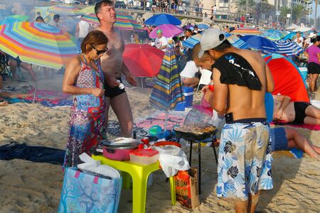 Palma de Mallorca, Spain / June 23, 2019: People meet in the beach near the sea to celebrate the evening and night of Saint John in the Spanish island.のeditorial素材
