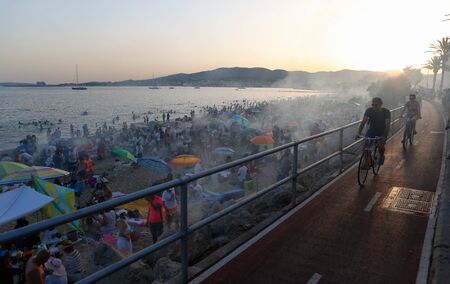 Palma de Mallorca, Spain / June 23, 2019: People meet in the beach near the sea to celebrate the evening and night of Saint John in the Spanish island.のeditorial素材