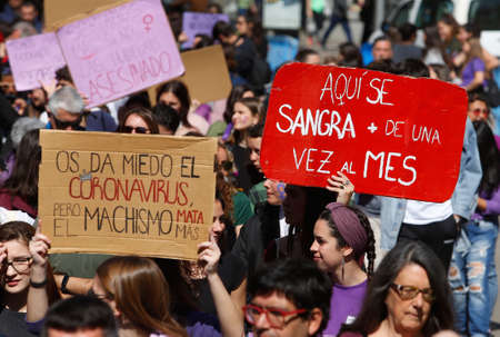 Palma de Mallorca / Spain - March 8, 2020: Women march wearing banners and shouting slogans during the Internationa Women Day (8th March) in Palma de Mallorca.のeditorial素材