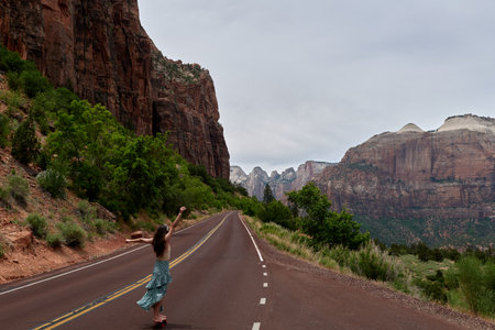 Girl on the road in Zion National Park, Utah, USA.