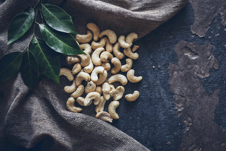 Cashew nuts on rustic background, top view, copy spaceの写真素材