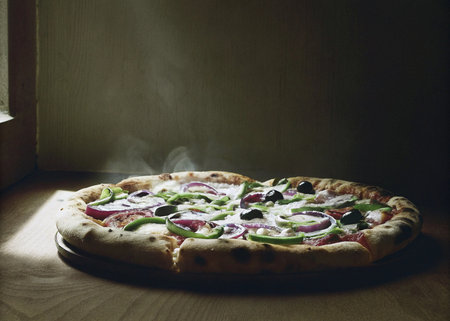 Pizza with mozzarella, black olives and red onionの写真素材