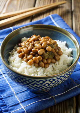 Cooked beans with rice in a bowl on a wooden table.の写真素材