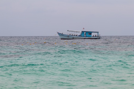 One boat floating in the seaの素材