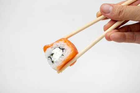philadelphia maki rolls with soy sauce, pink ginger, wasabi on white background, asian food, japanese cuisineの写真素材