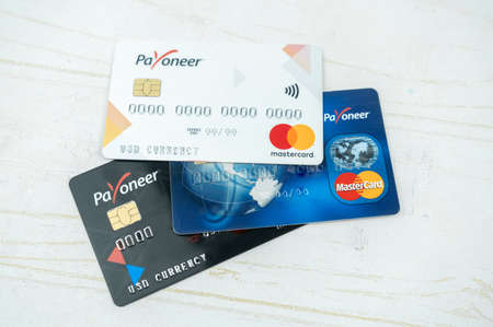 Set of Payoneer cards on a table. Debit cards, money transfer concept. Kiev, Ukraine - August, 2020