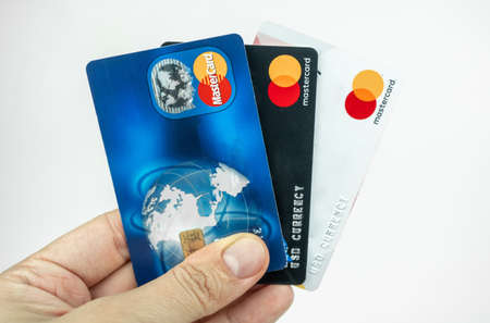 Set of Mastercard cards in a hand. Debit cards, money transfer concept. Kiev, Ukraine - August, 2020のeditorial素材