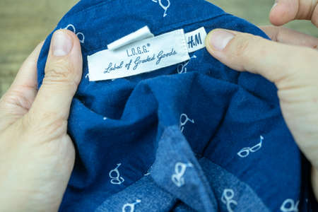 H&M brand shirt on inside label, cotton wear, casual clothes. Vienna, Austria - January, 2019のeditorial素材