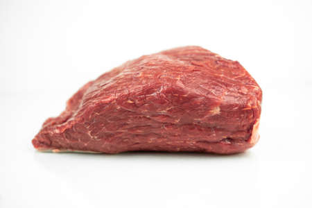 large piece of beef tenderloin, raw meat, isolated on whiteの写真素材