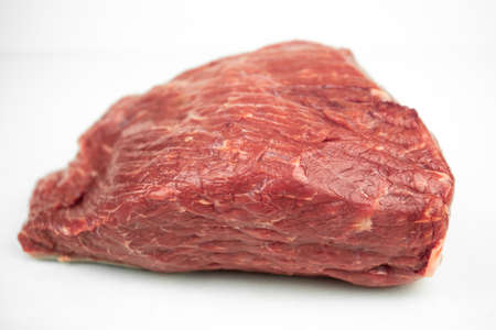 large piece of beef tenderloin, raw meat, isolated on whiteの写真素材