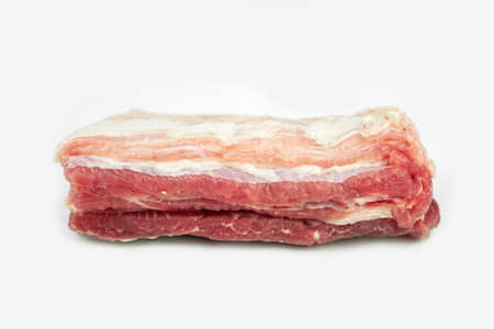 piece of fat pork ribs, raw meat, isolated on whiteの写真素材